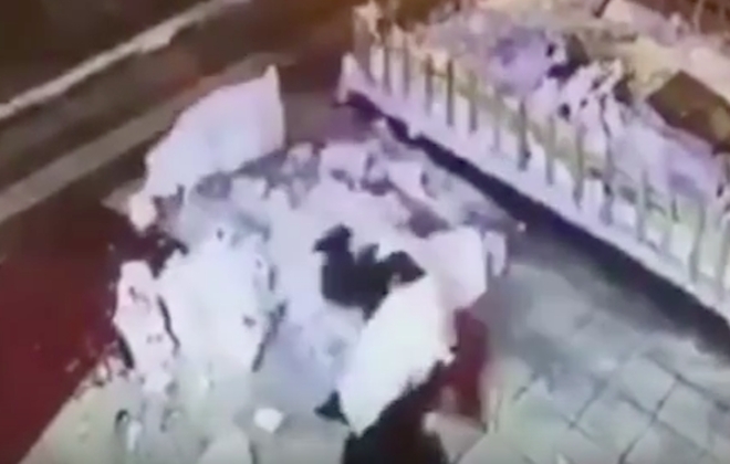 Woman Kicks Over Snowman, Slips And Falls Hilariously