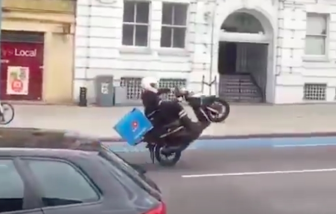 Pizza Delivery Driver Executes Flawless Wheelie Down Road... Then Falls